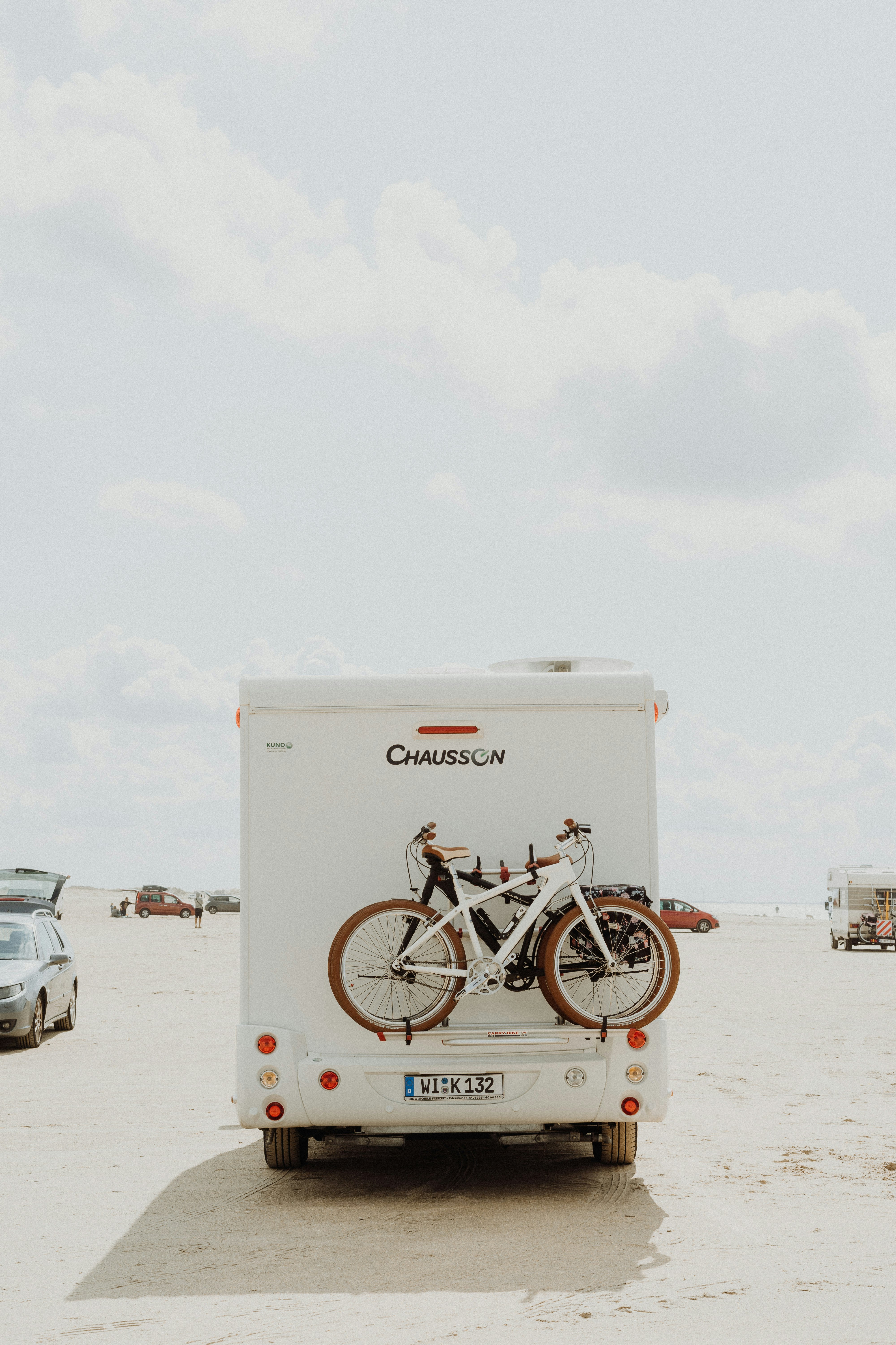 white and black bicycles on vehicle